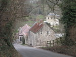 SX01052 Stone houses framed by high hedges and trees.jpg